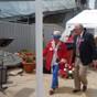 Description: El Cerrito Mayor Bill Jones escorts El Cerrito Garden Club President Fleda Mackie at the dedication of a Blue Star Marker by the club, in cooperation with the Richmond Museum of History, at the SS Red Oak Victory in Richmond, Memorial Day, May 28, 2012.